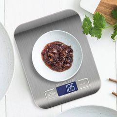 SKY-TOUCH Digital Kitchen Scale with stainless steel surface and LCD display. Digital kitchen scale showing precision weighing up to 5kg/1g. 