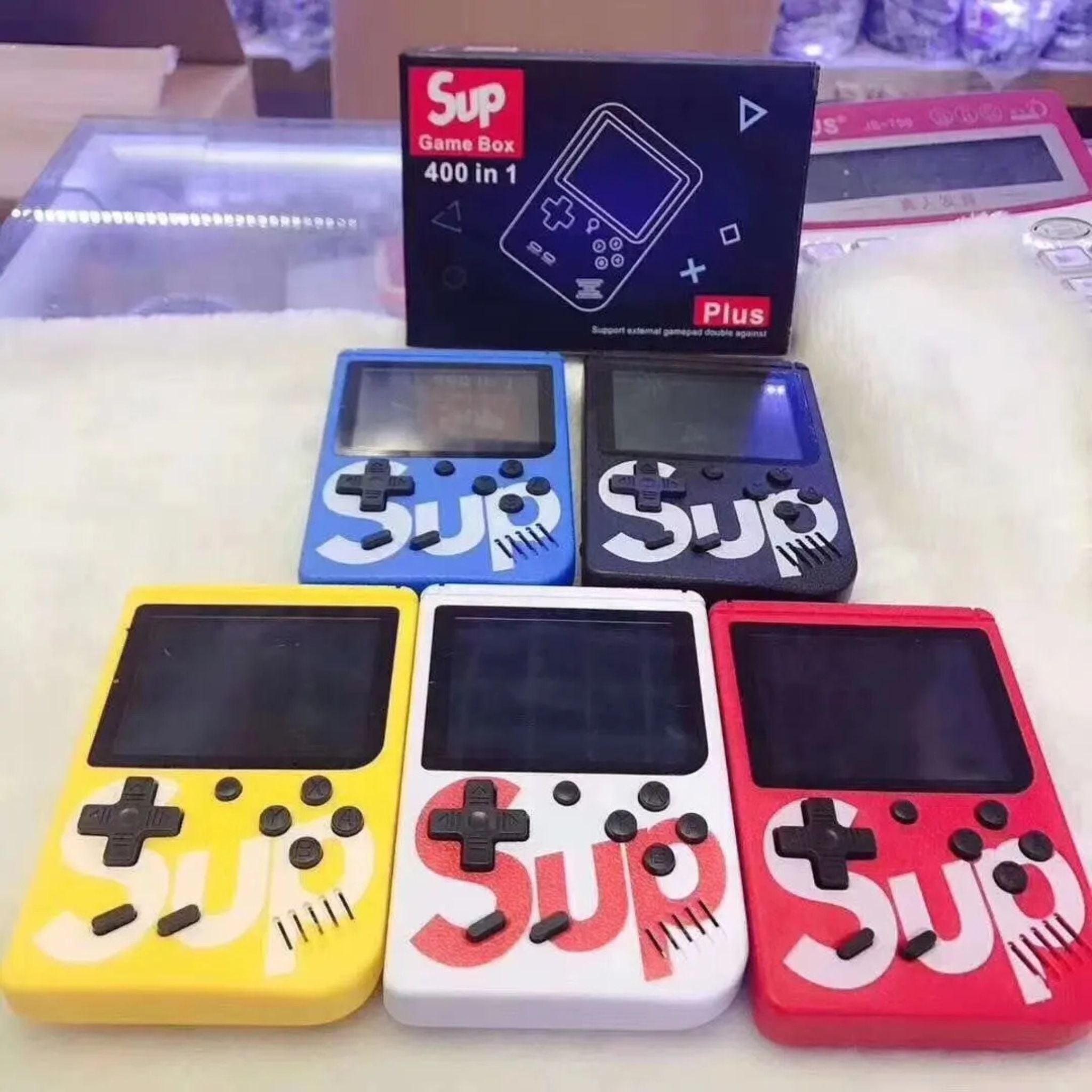 "Sup Game Box Plus 400 – Portable retro gaming console with 400 built-in classic games, compact design, and rechargeable battery."