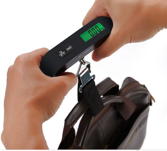 T-shaped Electronic Luggage Scale displaying weight on the digital screen. Compact and lightweight T-shaped Luggage Scale, perfect for travel.